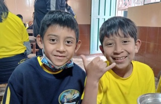 Boys eating Mary's Meals in Ecuador